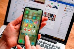 File image of a user scrolling social media apps on his phone.