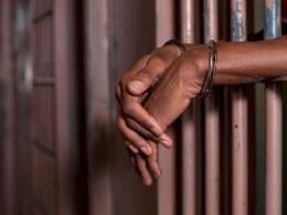 File image of a person in handcuffs.