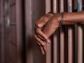 File image of a person in handcuffs.