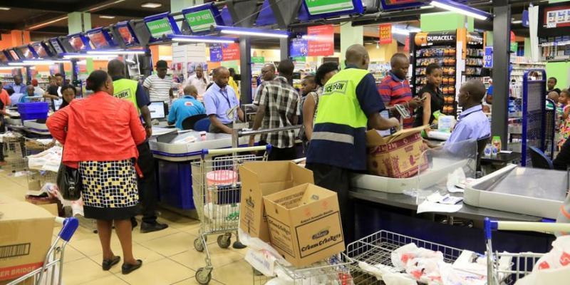 file image of people shopping at a supermarket.