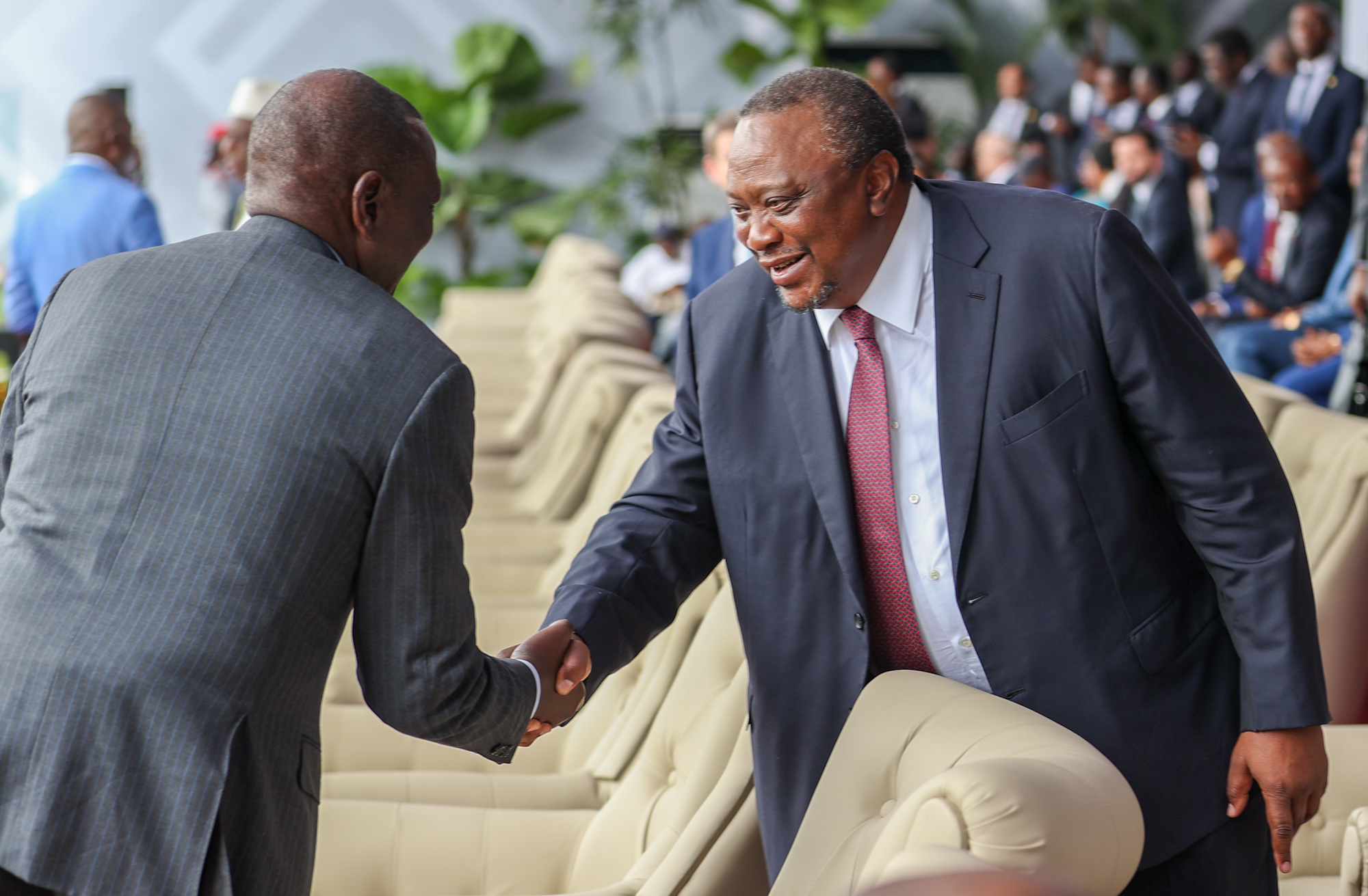 President William Ruto shaking hands with Uhuru Kenyatta in DRC.