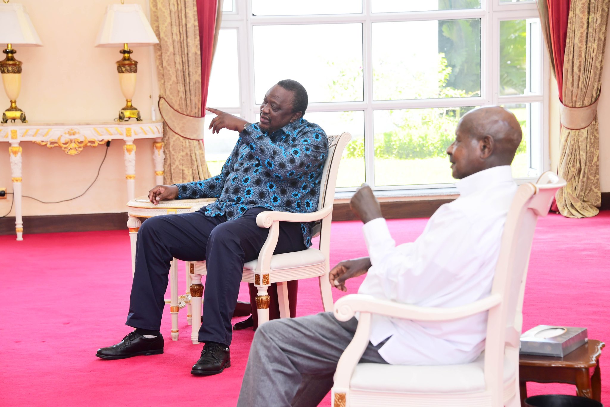 Former President Uhuru Kenyatta with President Yoweri Museveni in Uganda.