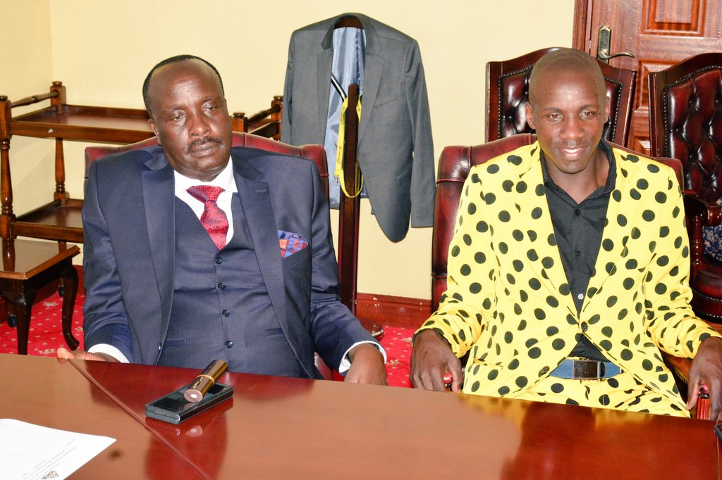 Singer Chris Embarambamba with his lawyer Danstan Omari.