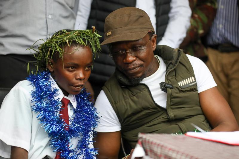 Sports CS Ababu Namwamba with Mercy Chepngeno.