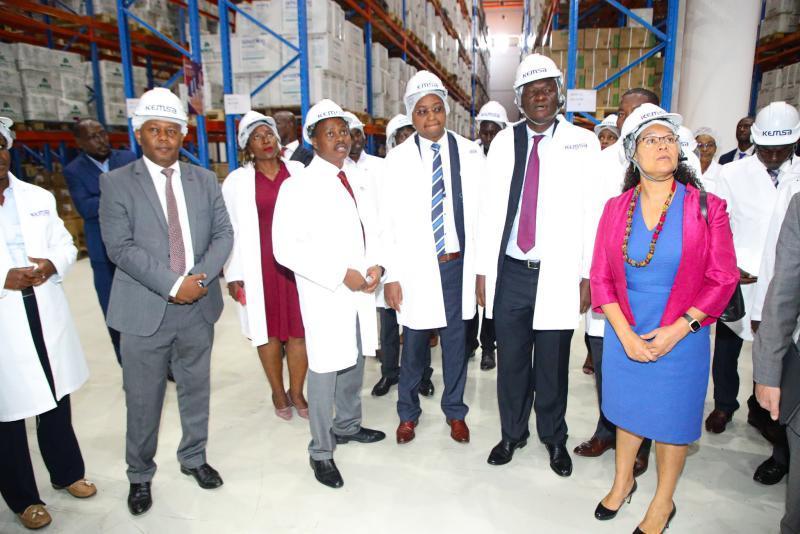 Dr Patrick Amoth, Ag Director General with Ministry of Health officials at KEMSA warehouse in Nairobi.