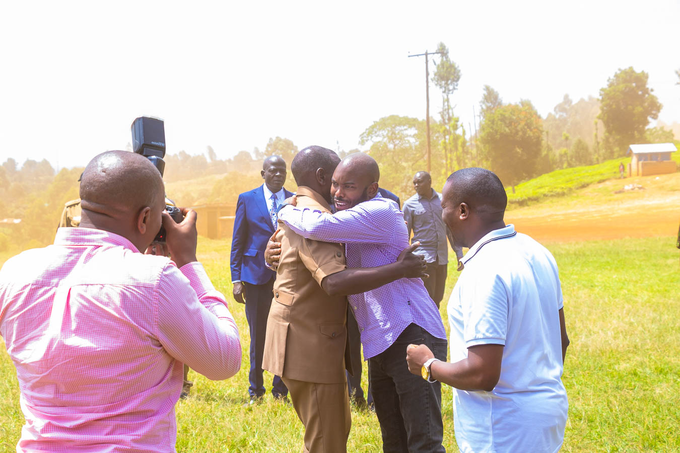 File image of President William Ruto hugging Gabriel Kagombe.