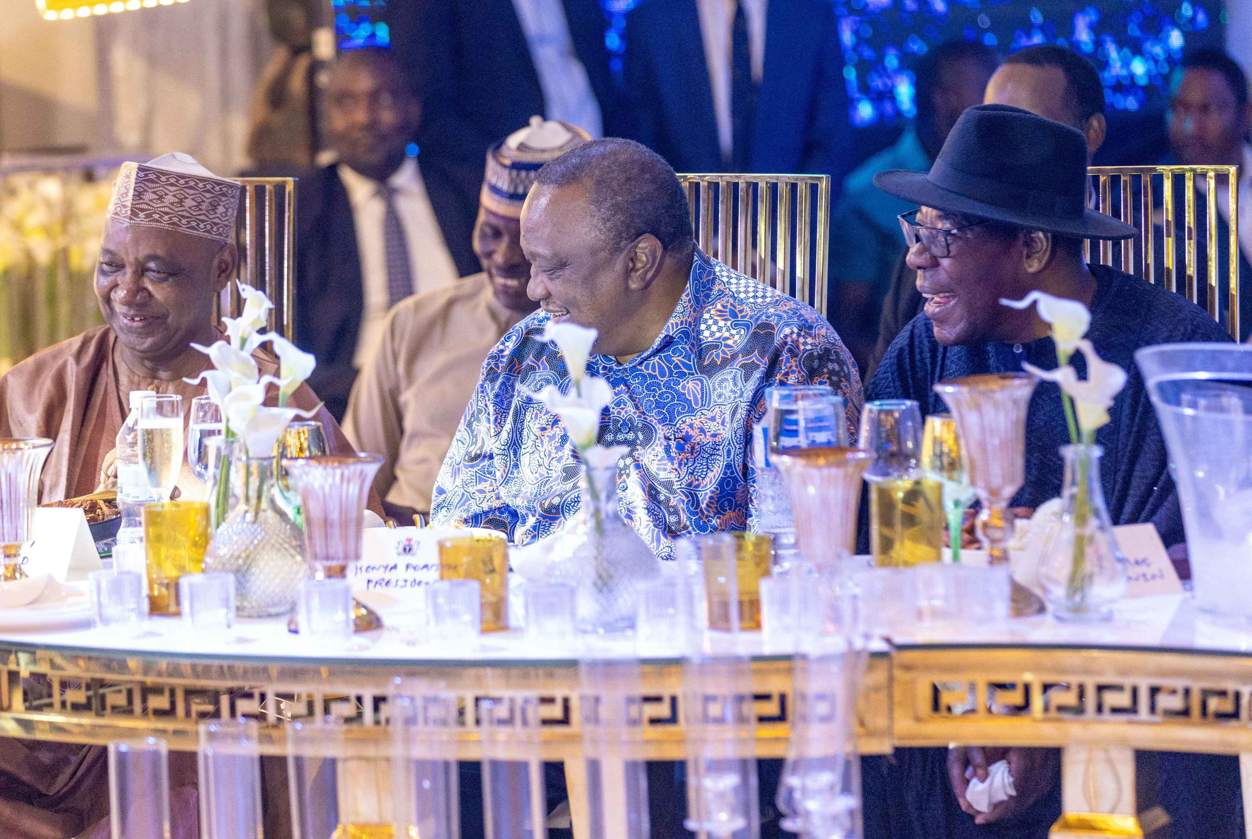 Former President Uhuru Kenyatta attends a state banquet in Nigeria.