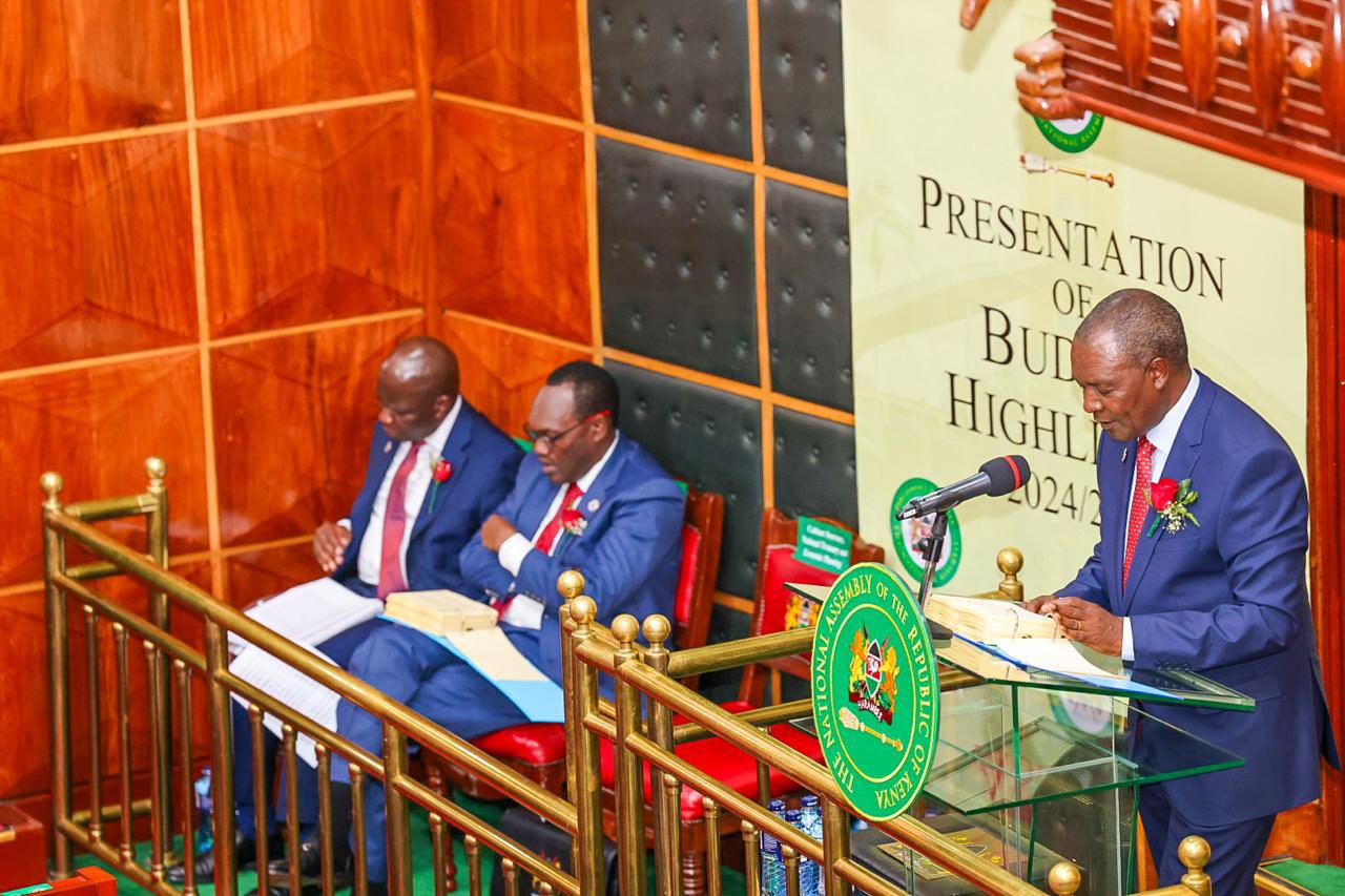 Treasury CS Njuguna Ndung'u reading the 2024/2025 budget in the National Assembly.
