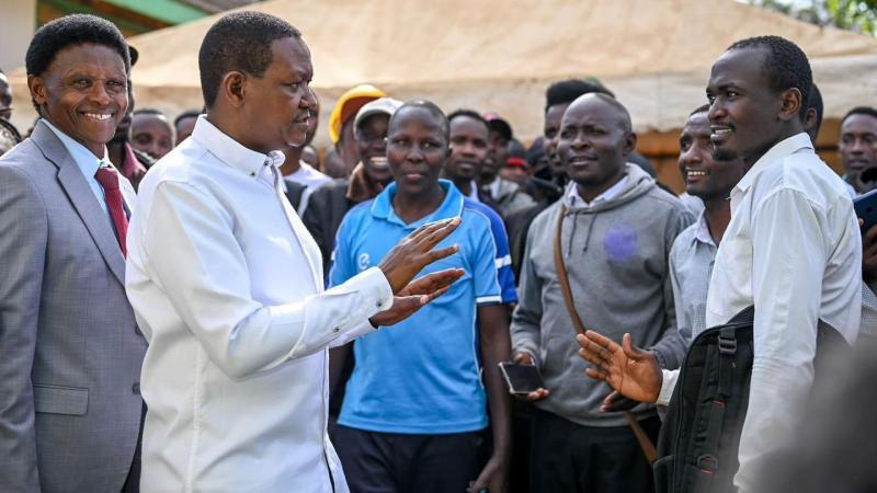 File image of Alfred Mutua interacting with job seekers