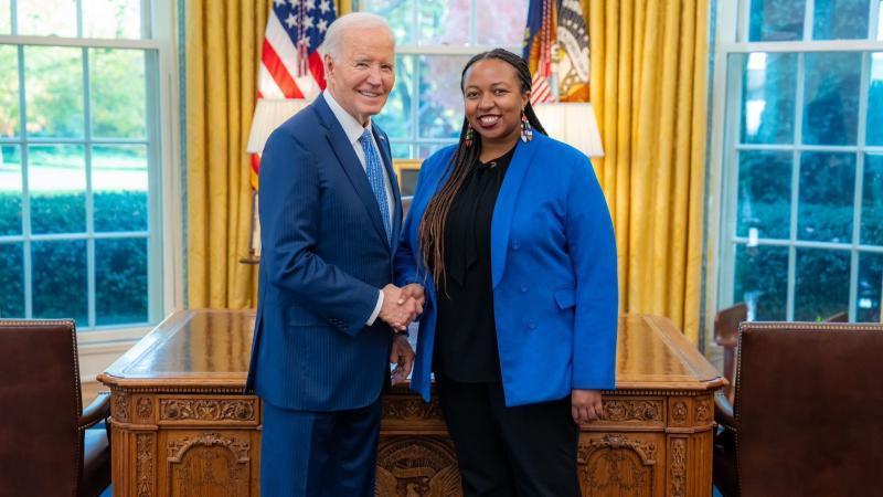 File image of Polly Irungu and outgoing President Joe Biden