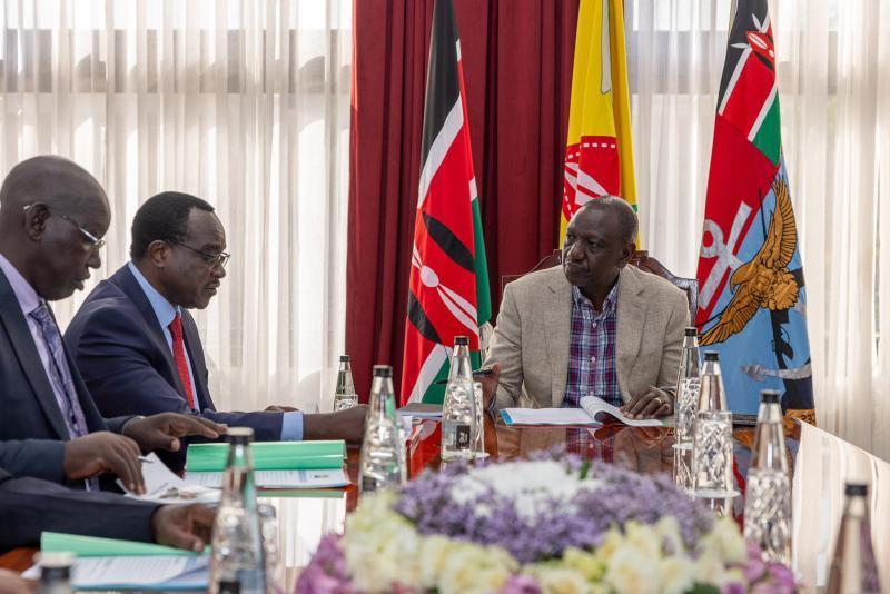 File image of President William Ruto with Education CS Julius Ogamba.