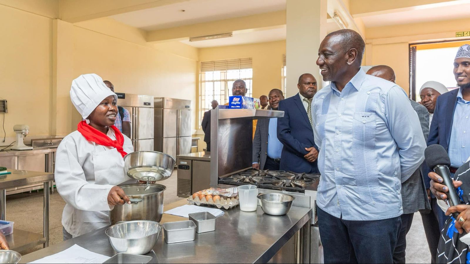 File image of President William Ruto interacting with a student at Kamukunji Technical and Vocational College