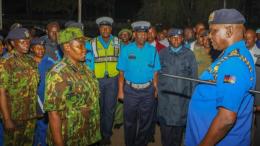 File image of IG Douglas Kanja interacting with a police officer