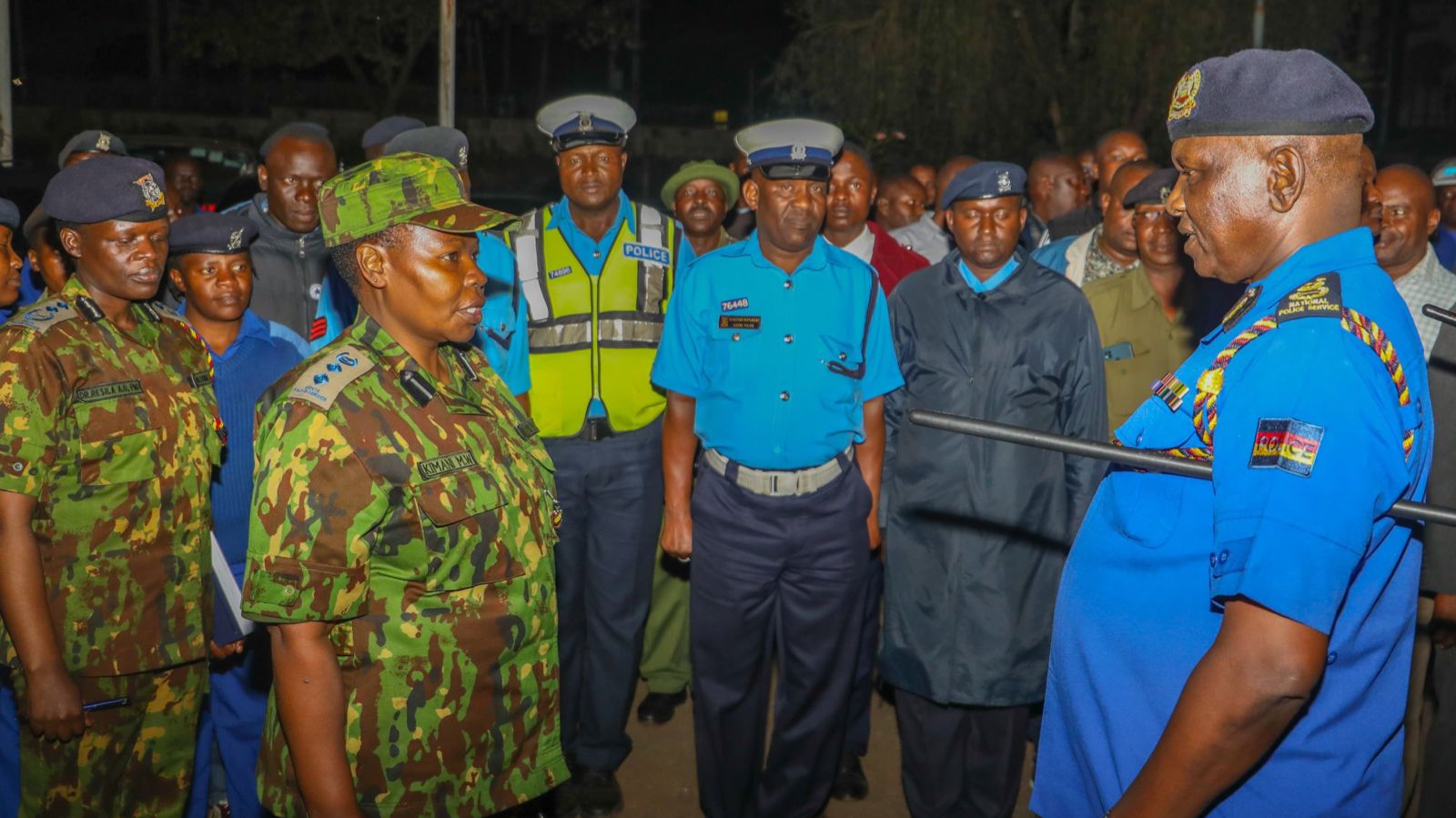 File image of IG Douglas Kanja interacting with a police officer