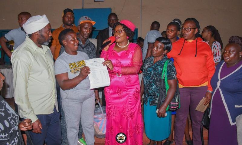 File image of MP Wamuchomba issuing bursaries in Githunguri