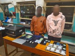 File image of two suspects caught flashing phones in Eldoret, Uasin Gishu County.