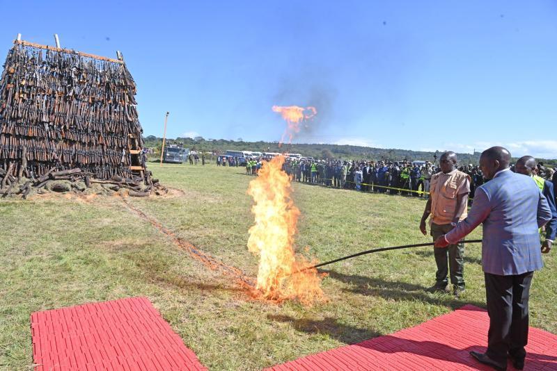 President William Ruto setting illegal firearms on fire in Ngong, Kajiado County.