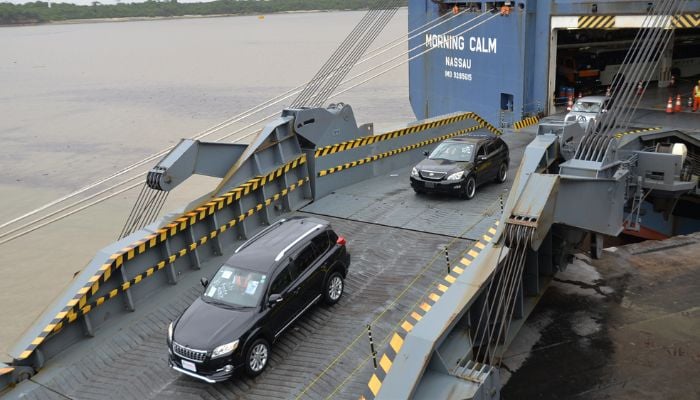 Vehicles being offloaded from a ship in Mombasa.