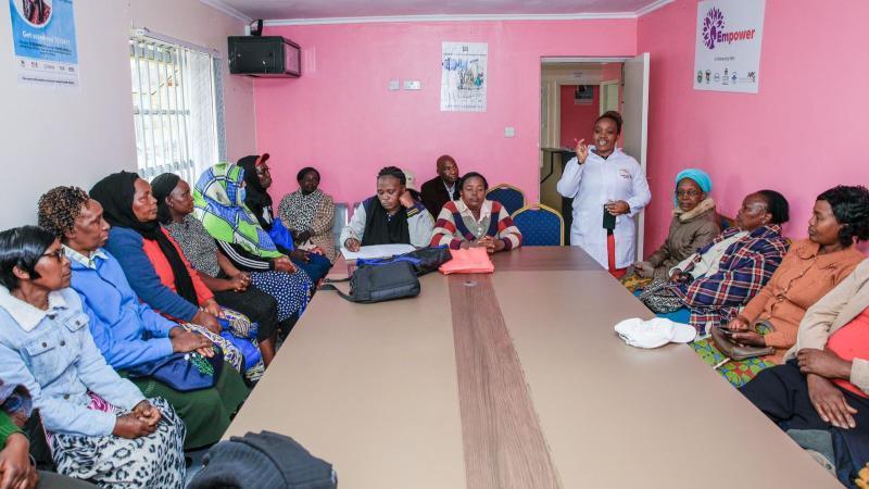 File image of a healthcare worker speaking with a group of women at the Kerugoya Hospital Cancer Centre