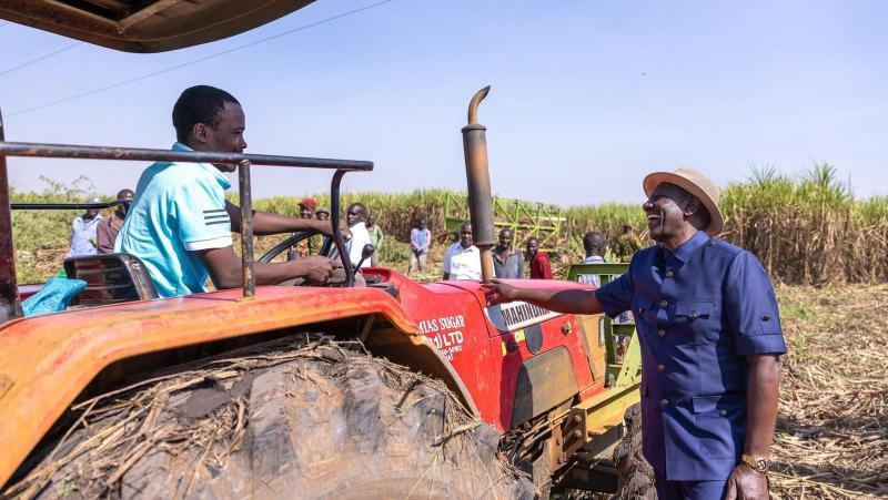 File image of President William Ruto interacting with a sugarcane farmer