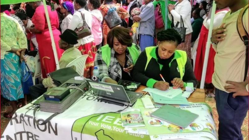File image of IEBC officials in a past drive to enlist voters