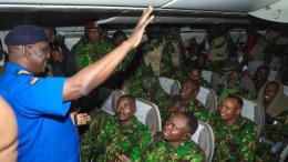 File image of the Inspector General of Police Douglas Kanja interacting with officers flying to Haiti