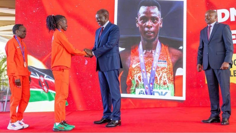 File image of President William Ruto interacting with Faith Cherotich as Peres Jepchirchir and Deputy President Kithure Kindiki look on
