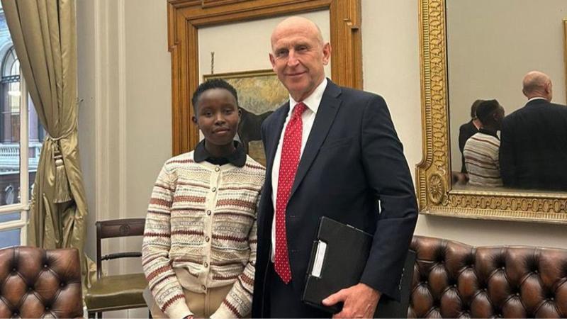 File image of Esther Njoki and UK Defence Secretary John Healey