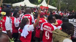 File image of Arsenal fans at Raila Odinga's gravesite in Bondo