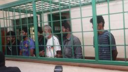 File image of the six suspects in court