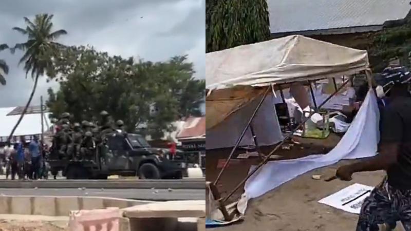File image of security officers and a vandalized polling station