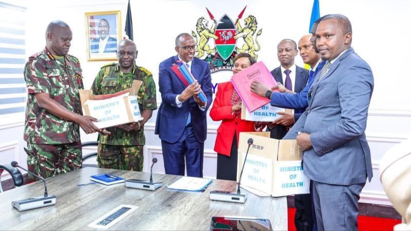 File image of Health Cabinet Secretary Aden Duale handing over the files
