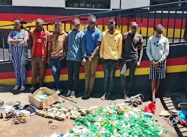 File image of 8 suspects arrested over fraud.