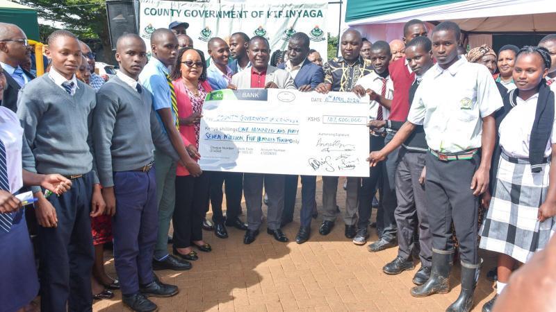 File image of Governor Anne Waiguru handing over a cheque