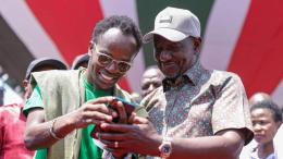 File image of President William Ruto with a NYOTA Fund beneficiary