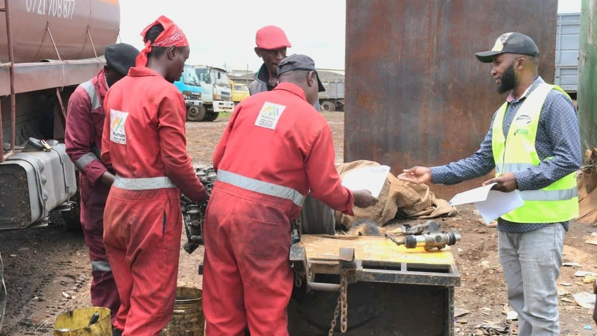 File image of a KeNHA official handing out a notice
