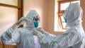 File image of medical personnel handling Ebola cases
