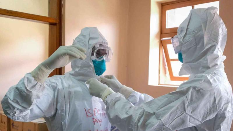 File image of medical personnel handling Ebola cases