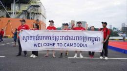 File image of port workers welcoming visitors to Cambodia