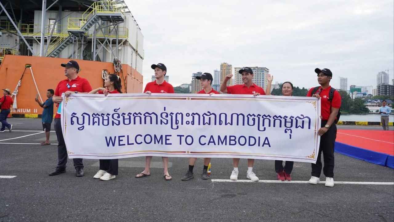 File image of port workers welcoming visitors to Cambodia