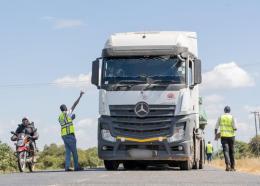File image of IRA officers checking motor insurance certificates.