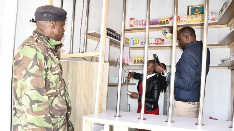 File image of PPB officials inspecting a drug store
