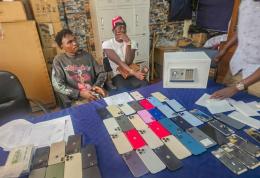 File image of two suspects arrested during a crackdown on stolen phones in Nairobi CBD.