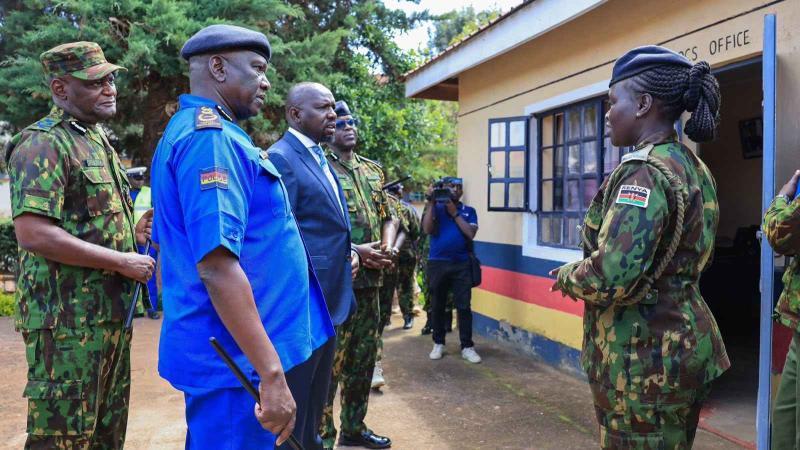 File image of Inspector General of Police Douglas Kanja and Interior Cabinet Secretary Kipchumba Murkomen interacting with police officers