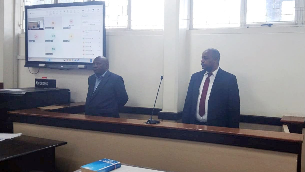 File image of Magistrate Martin Kinyua and his co-accused in court