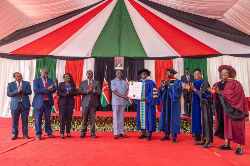 File image of President William Ruto awarding a Letter of Interim Authority to Kamagambo University
