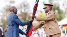 File image of President William Ruto receiving the flag