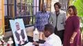 File image of Treasury Principal Secretary Chris Kiptoo signing the condolence book at Fred Segor's home