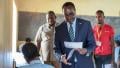 File image of Education Cabinet Secretary Julius Ogamba distributing tests